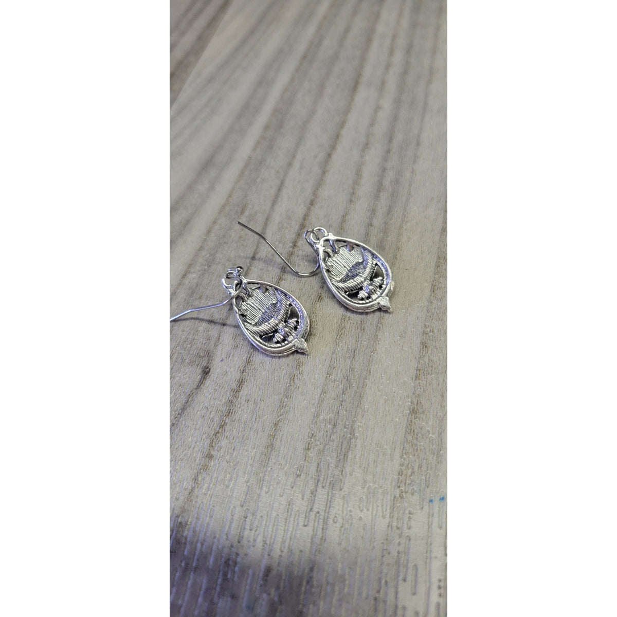 Sliver dangle earrings with blue stones