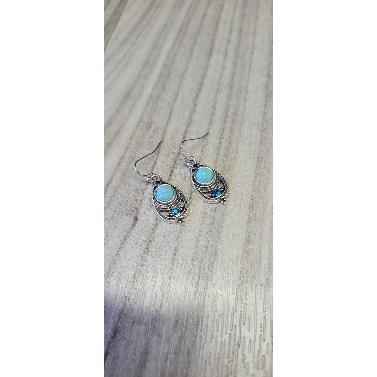 Sliver dangle earrings with blue stones