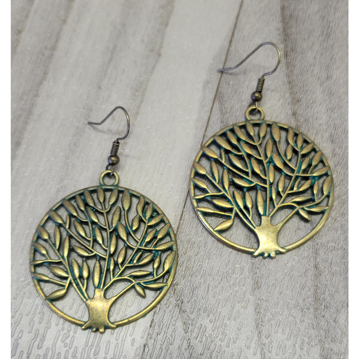 Gold tone tree of life earrings