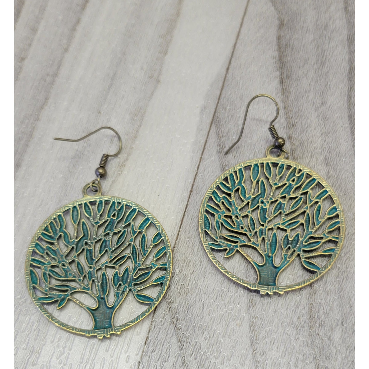 Gold tone tree of life earrings